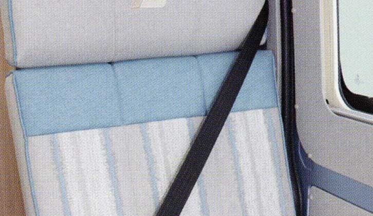 A nearside forward-facing travel seat