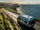 A campervan driving along the Atlantic Highway