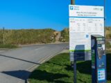 A sign at Barkby Beach Car Park showing costs for parking in 2022