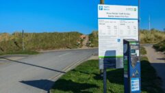A sign at Barkby Beach Car Park showing costs for parking in 2022