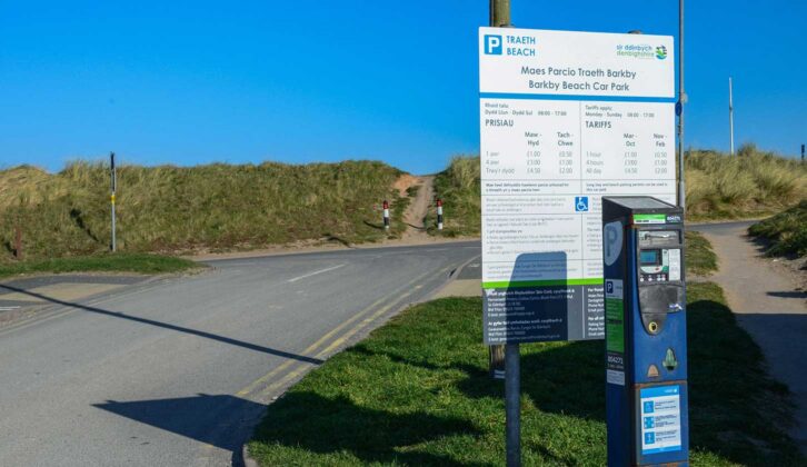 A sign at Barkby Beach Car Park showing costs for parking in 2022