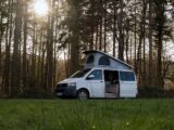 A campervan in a forest setting