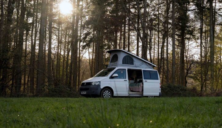 A campervan in a forest setting