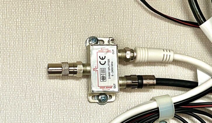 The splitter fitted with the F-type to co-ax TV adaptor attached