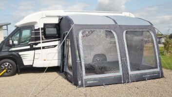 A motorhome with an awning erected