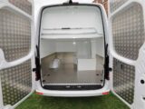 Looking through the barn doors of a a Mercedes Sprinter converted by Mclaren for Sir Bradley Wiggins