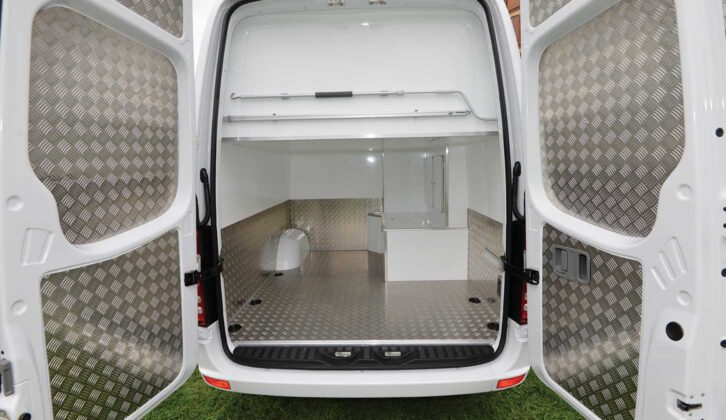 Looking through the barn doors of a a Mercedes Sprinter converted by Mclaren for Sir Bradley Wiggins