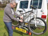 A Thule bike rack on the back of a campervan