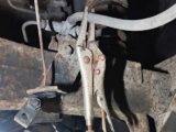A pair of locking pliers on the rear brake hose