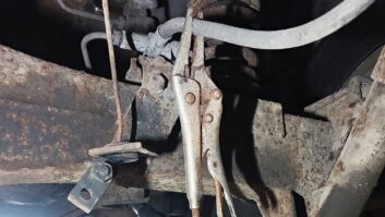 A pair of locking pliers on the rear brake hose