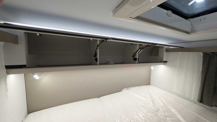 Lighting underneath the overhead lockers