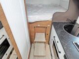 Fold-out steps to reach the bed