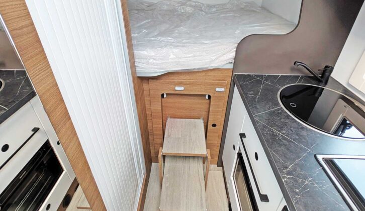 Fold-out steps to reach the bed