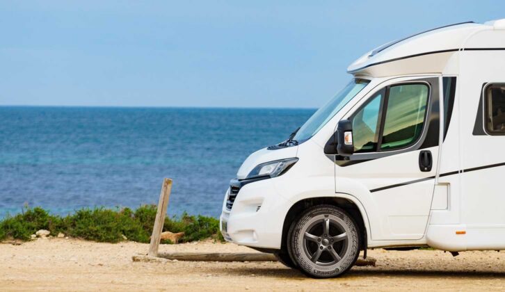 A motorhome parked by the sea with VanContact Ultra Camper