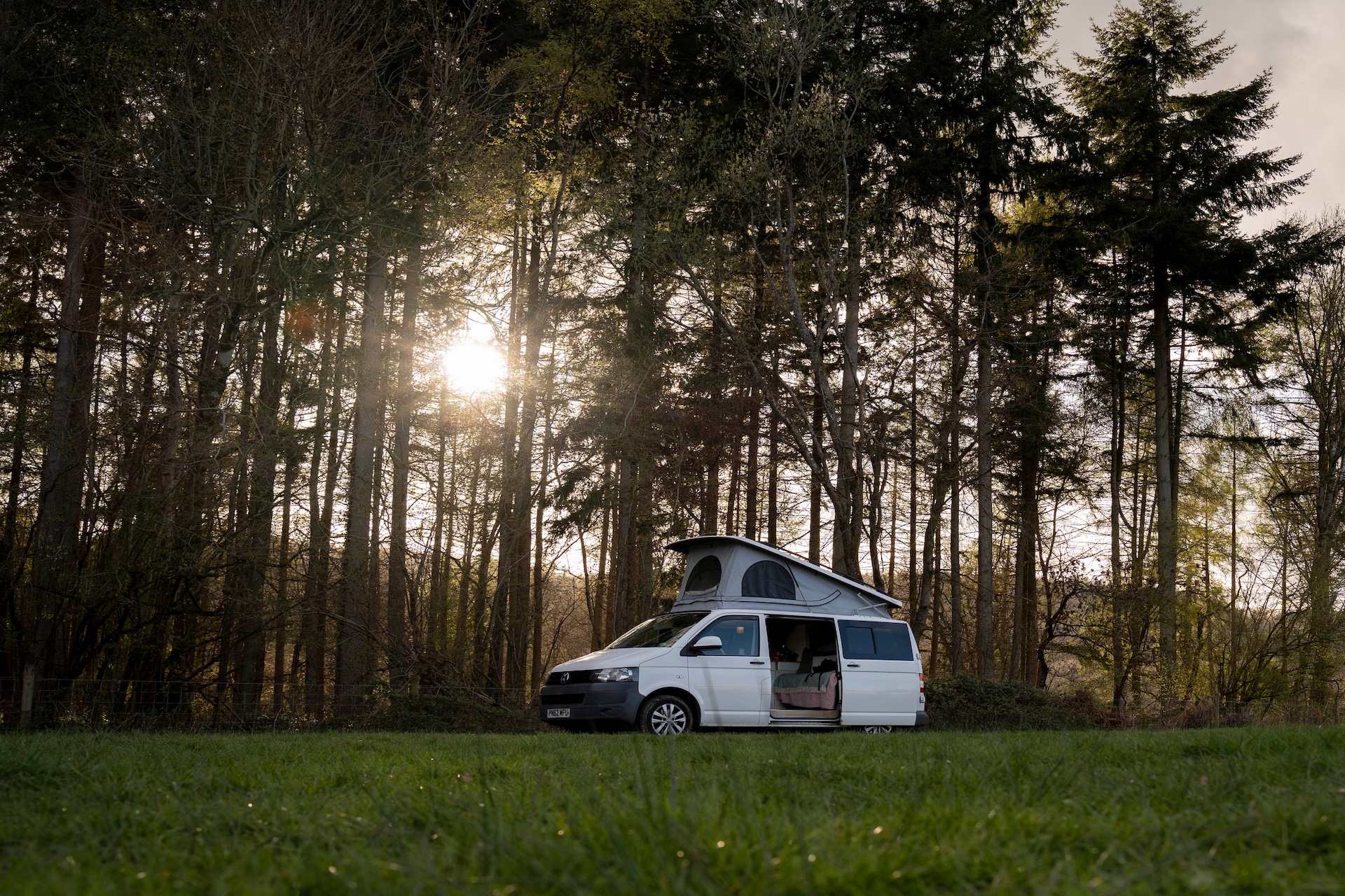 Forest campervan in sunset