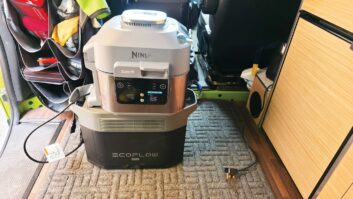 An EcoFlow portable power station with a Ninja air fryer on top of it