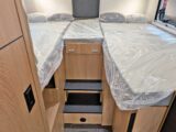The bed at the rear of the 'van