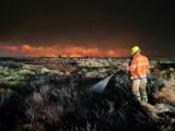 A firefighter tackling the blaze