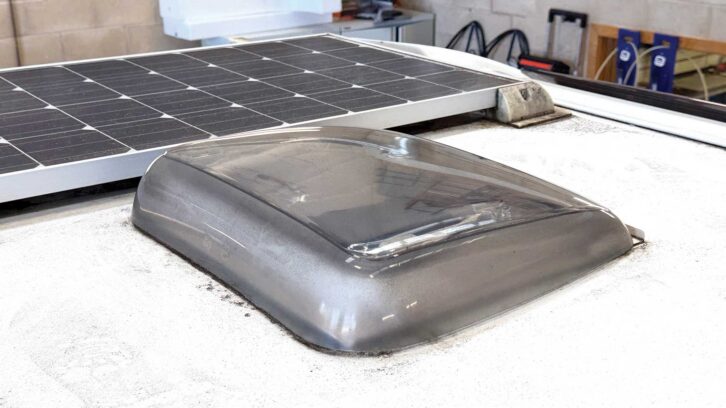 The rooflight aperture, next to solar panels