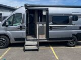 The Swift Carrera 122 from the side, with its sliding door open
