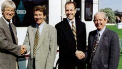 Roger Crafts (second from left) shaking hands
