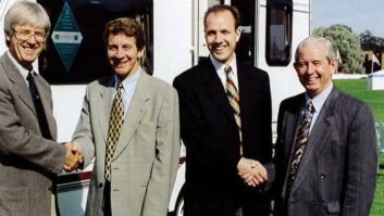 Roger Crafts (second from left) shaking hands