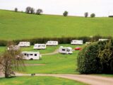 Motorhomes and caravans pitched up at Fir Tree Farm Campsite