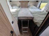 The fixed single beds at the back