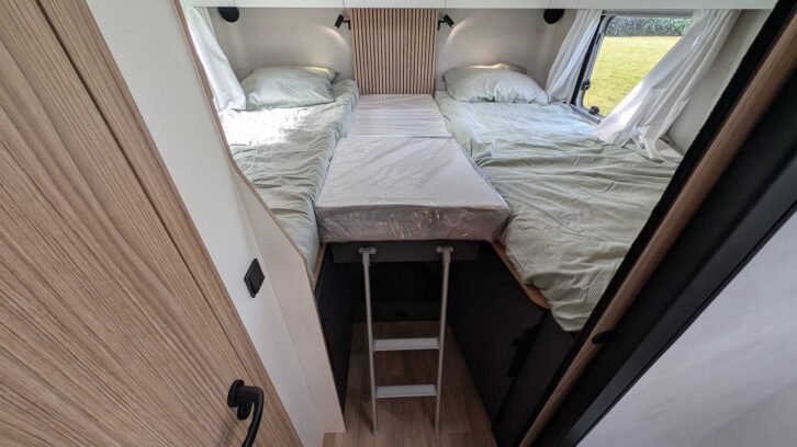 The fixed single beds at the back
