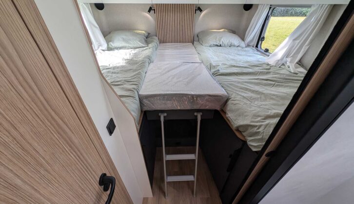 The fixed single beds at the back