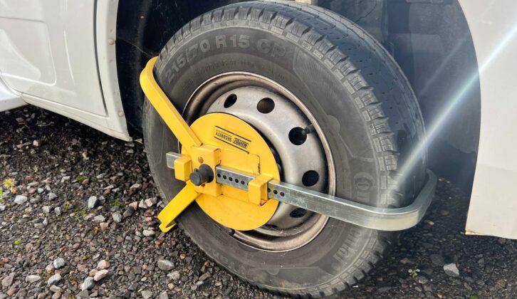 A wheel clamp in place on a 'van