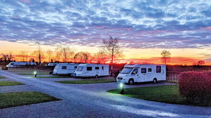 Vans pitched up at Black Bull Caravan Park