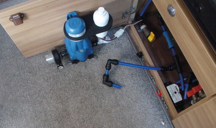 Removing the metal pipe so any sediment can be washed away