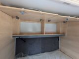 The two lockers above the bed