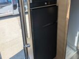 The fridge-freezer and oven