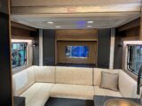 The rear lounge with the dropdown bed overhead in the 64-2