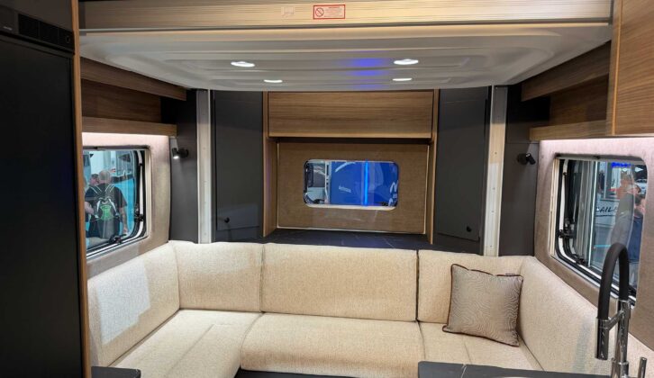 The rear lounge with the dropdown bed overhead in the 64-2