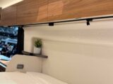 The lockers above the bed